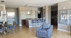 image of blue, white, and silver dining room and kitchen