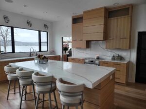 portfolio image of kitchen with marble island and barstools