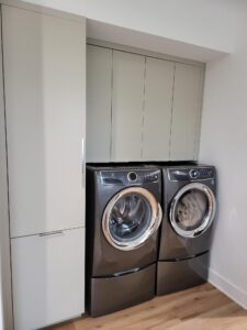 portfolio image of laundry room with grey cabinets