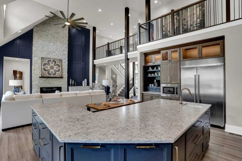 Blue and grey marble kitchen and living room interior of home
