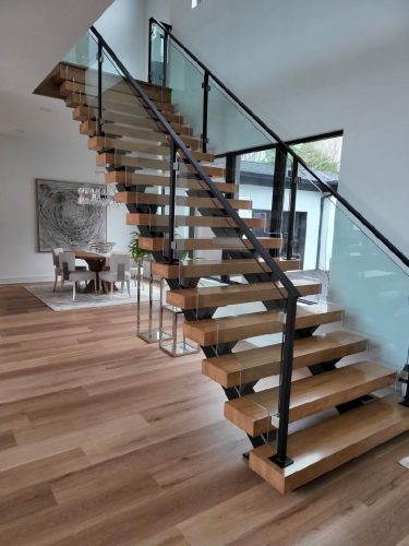 portfolio image of staircase and dining room in home