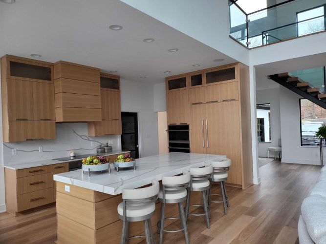 portfolio image of kitchen with marble island and barstools