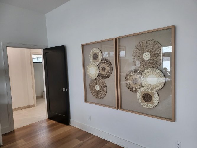 portfolio image of wicker wall art hung in bedroom
