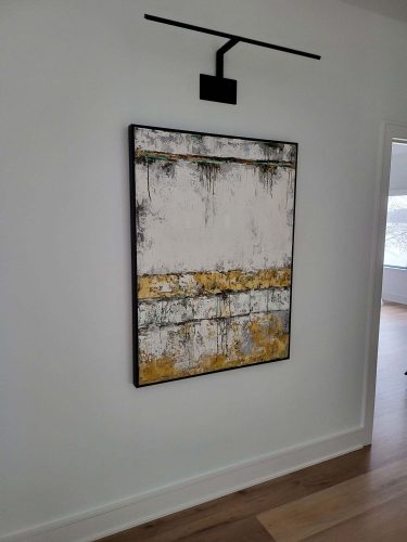 portfolio image of white and yellow painting hanging on wall